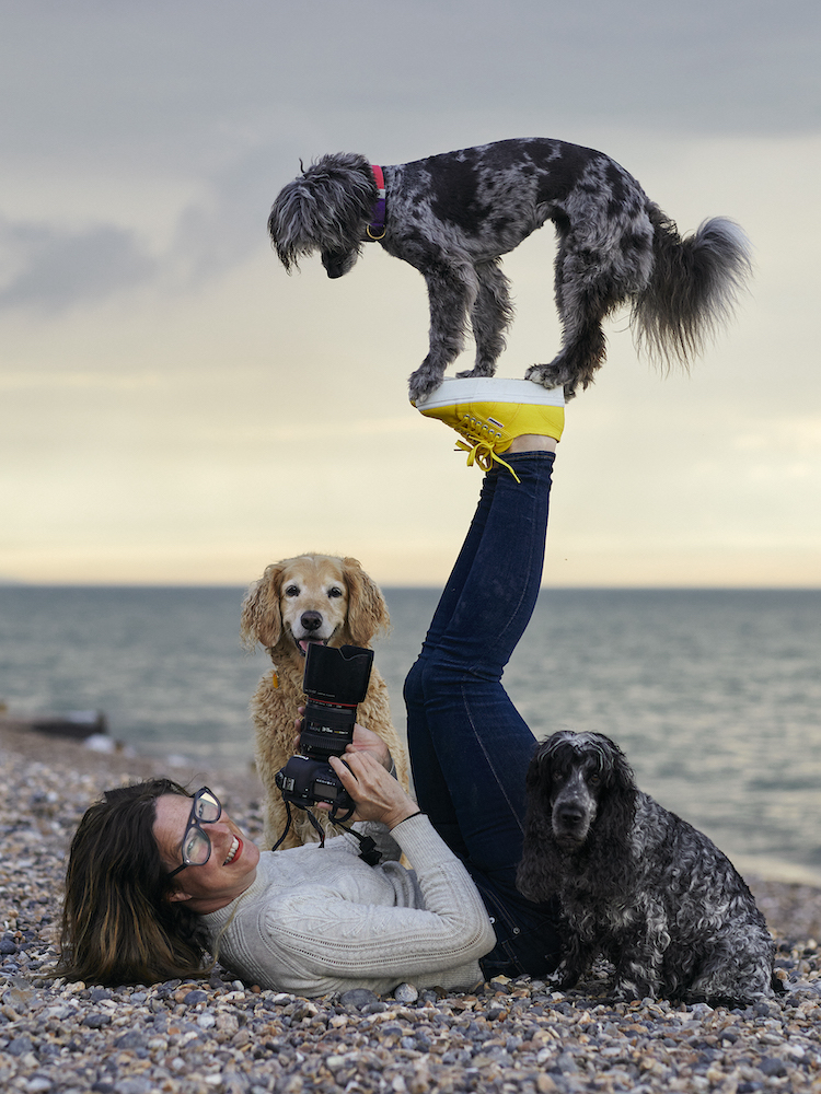 Photographer Liz Gregg and dogs performing balancing trick